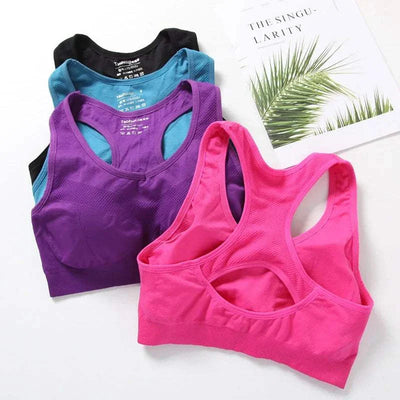 Set of seamless breathable women sports bras in pink, purple, blue, and black with racerback design for gym and activewear