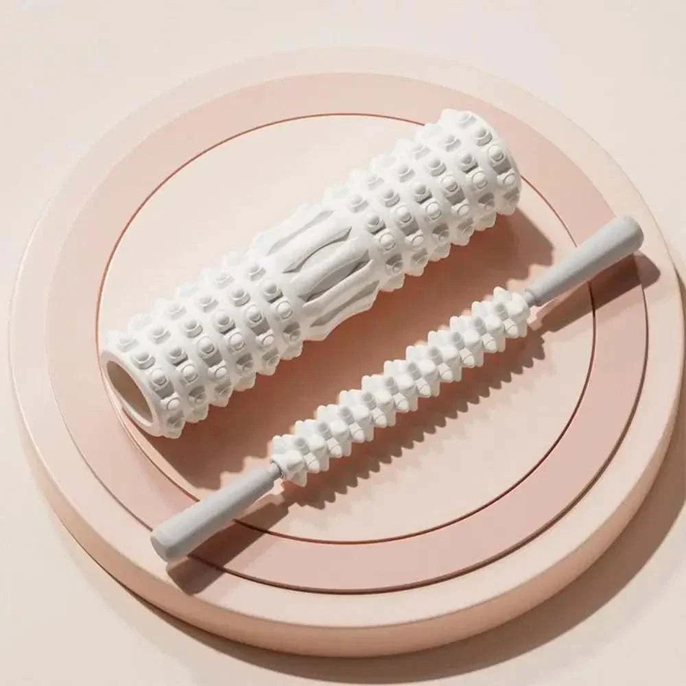 White high density foam muscle massage rollers on beige circular trays for fitness recovery and body stretching.