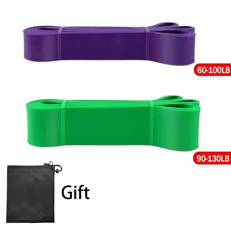 Heavy-duty purple and green resistance bands with carry pouch for strength training and pull-up assistance