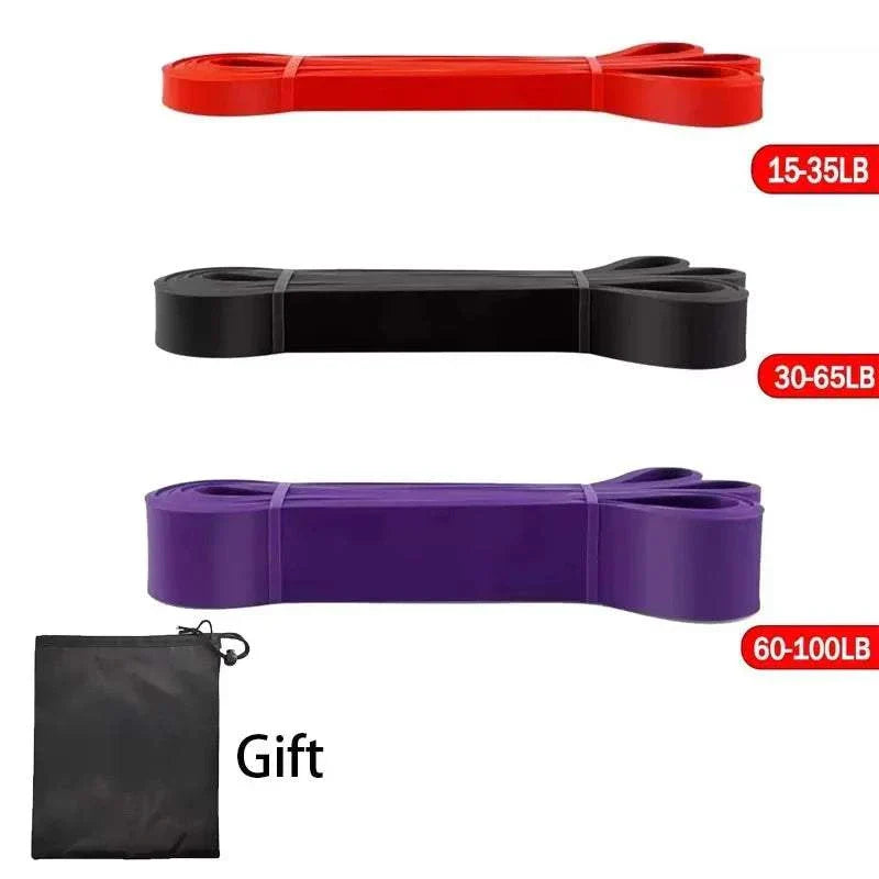 Heavy-duty resistance bands set with carry pouch for strength training and pull-up assistance in red, black, and purple colors.
