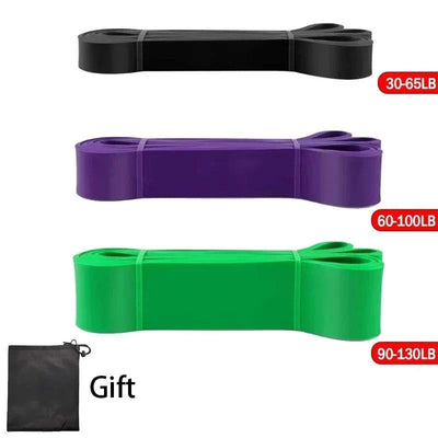 Set of heavy-duty resistance bands in black, purple, and green with different tension levels, including a carrying pouch, ideal for pull-up assistance and strength training.