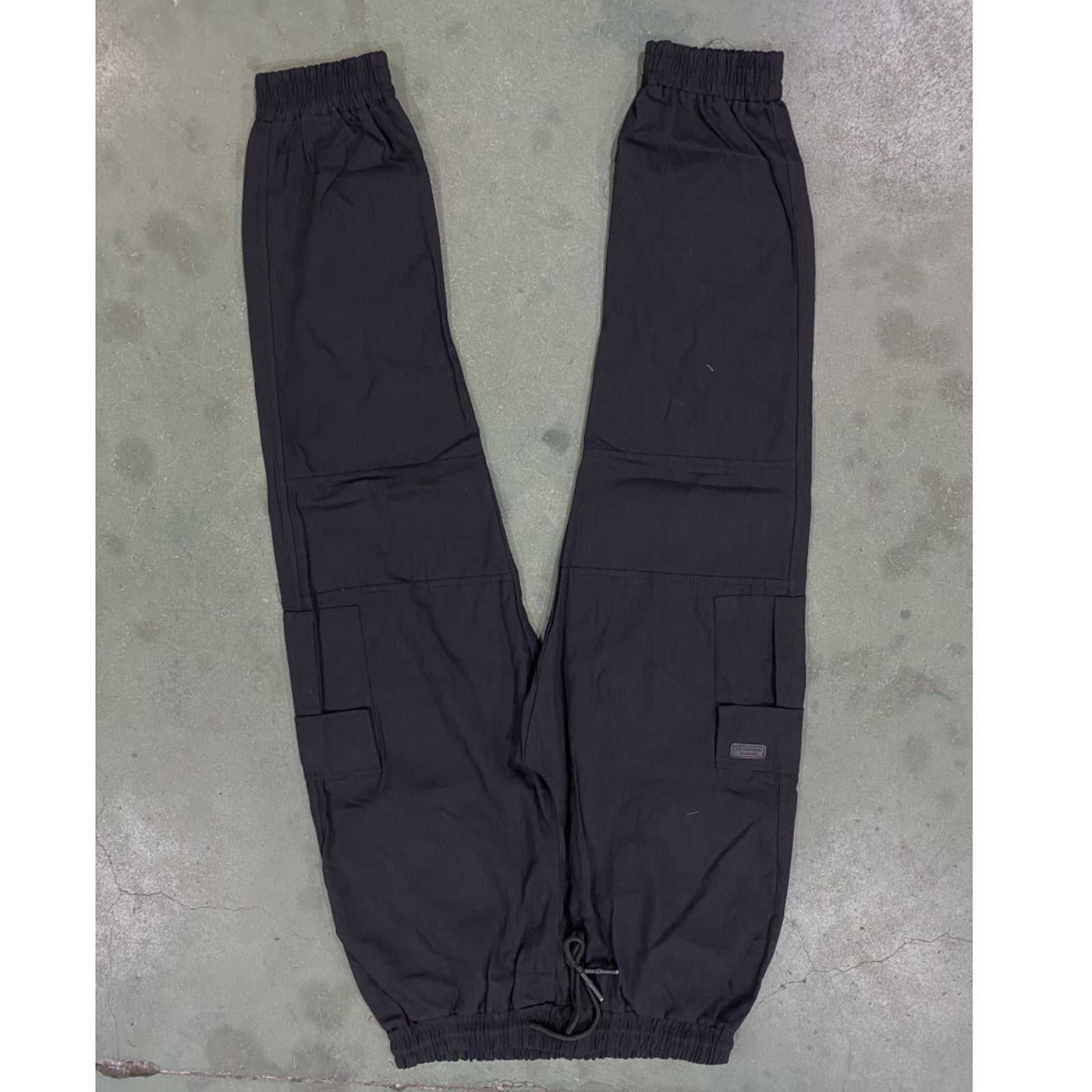 Men’s black outdoor waterproof hiking pants with drawstring waist and cargo pockets for camping summer hiking