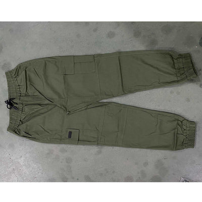 Men’s olive green outdoor waterproof hiking pants with pockets, breathable quick-dry fabric, and drawstring waist for camping summer hiking.